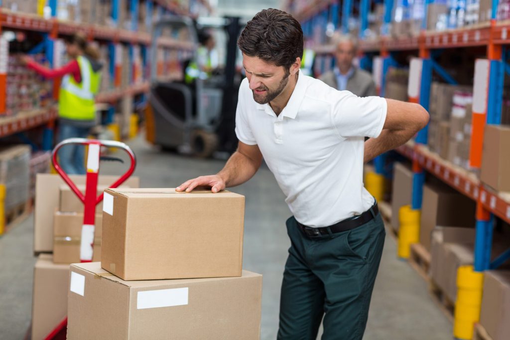 Back pain at work - inured factory worker - load too to carry backache